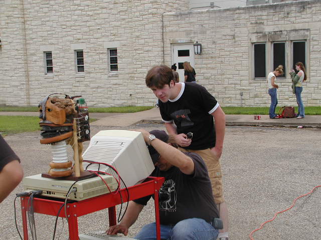 Producer-director, Chris Rose, looks on in awe as Eric Lundquist reprograms Babbling Head for its next lines.