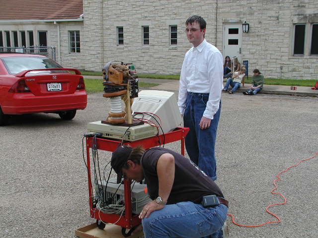 Eric Lundquist plays the unheralded role of hero by making the cart easier to roll across the asphalt (with an ordinary pizza box)